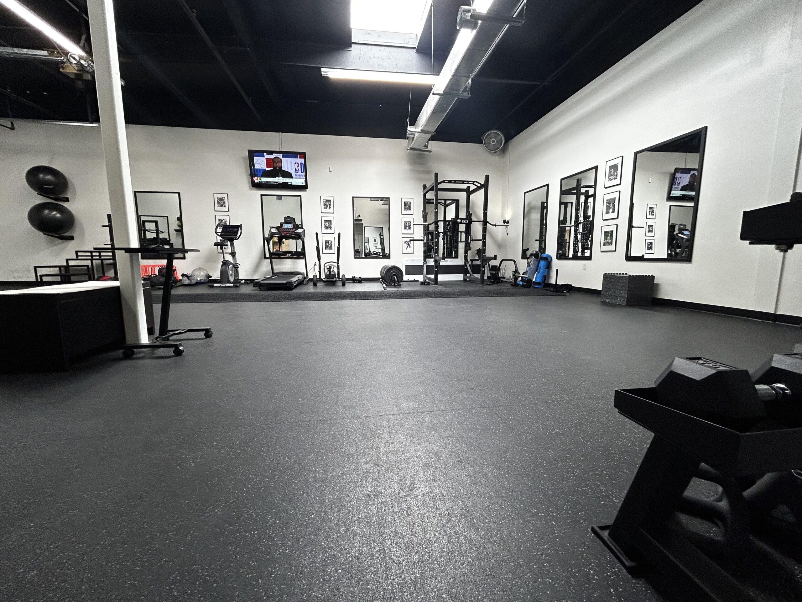 a gym with a large amount of equipment.